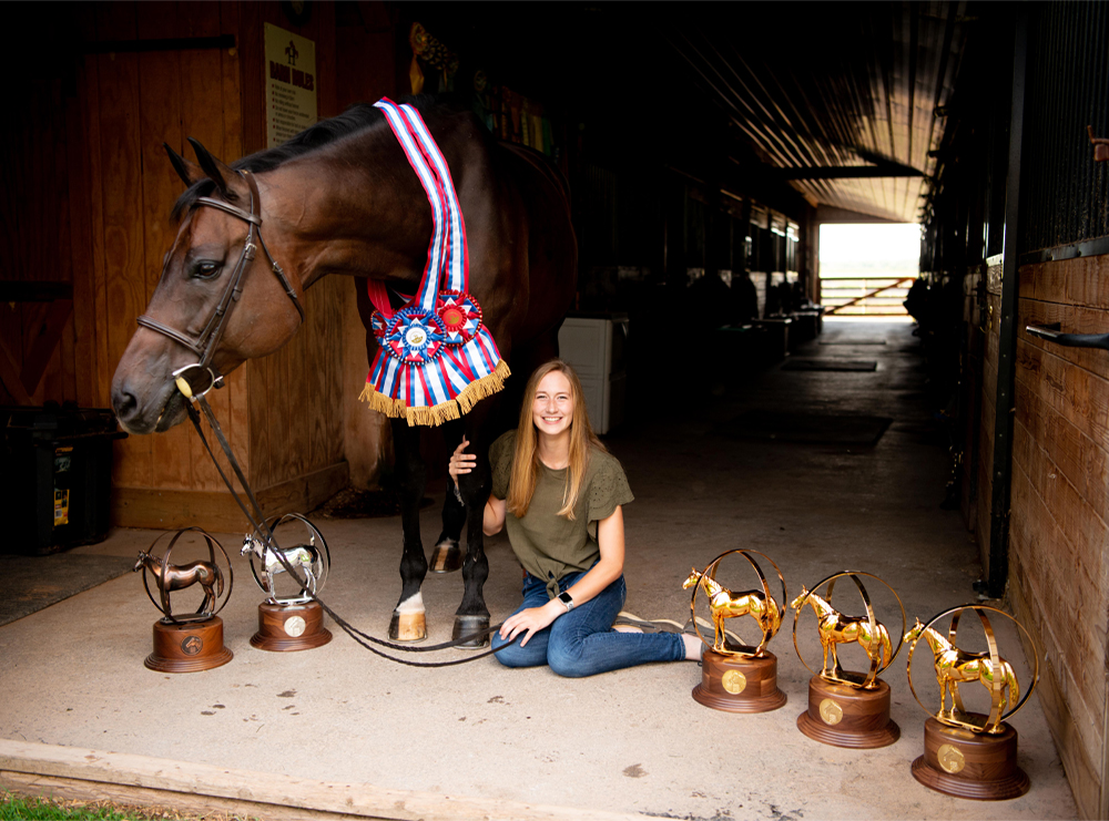Maddy Keyes and Classic Circle pose with their AQHYA World Championship globes