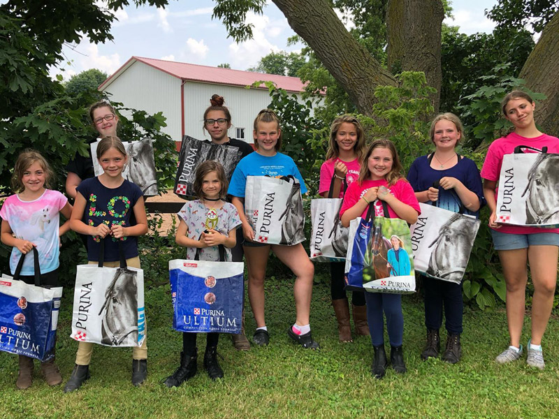 summer4 Campers hold their bags at summer horse camp