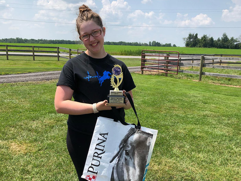 summer5 Regan Clayton holding award on the last day of summer camp