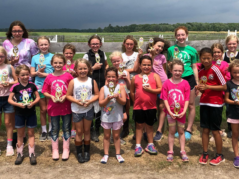 summer7 Campers holding trophies on the last day of horse camp