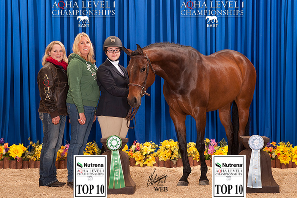 Trainers Virginia Beaton and Amy Hanssen pose with Brooklynn Czelusta and Mellow Evening at 2016 AQHA Level 1 Championships East